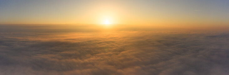 Fototapeta na wymiar Above the World: Witnessing the Daybreak Above Clouds