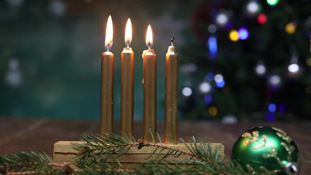 Three lighted candles of four on bokeh background, Christmas Advent concept