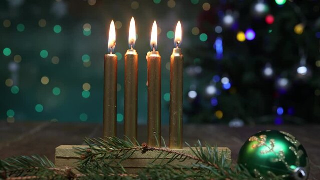 Four lighted candles on bokeh background, Christmas Advent concept
