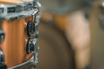 Close-up shot of a metallic drum with other instruments nearby