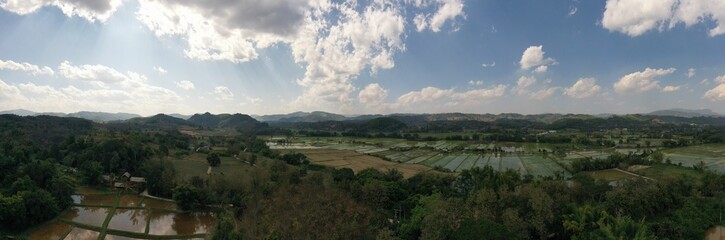 Panoramic view of green countryside with agricultural areas
