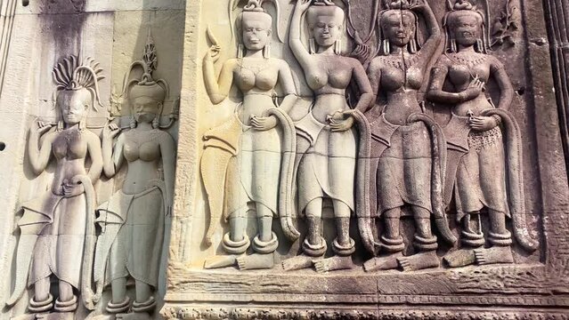 The famous bas-relief of Apsaras, celestial maidens, with intricate hairstyles on the inside wall of the first floor of the Angkor Wat temple in Siem Reap, Cambodia