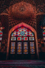 Low-angle of inside view of Nasir al-Mulk mosque with colorful window