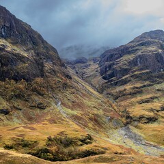 Rocky cliffs covered with clouds