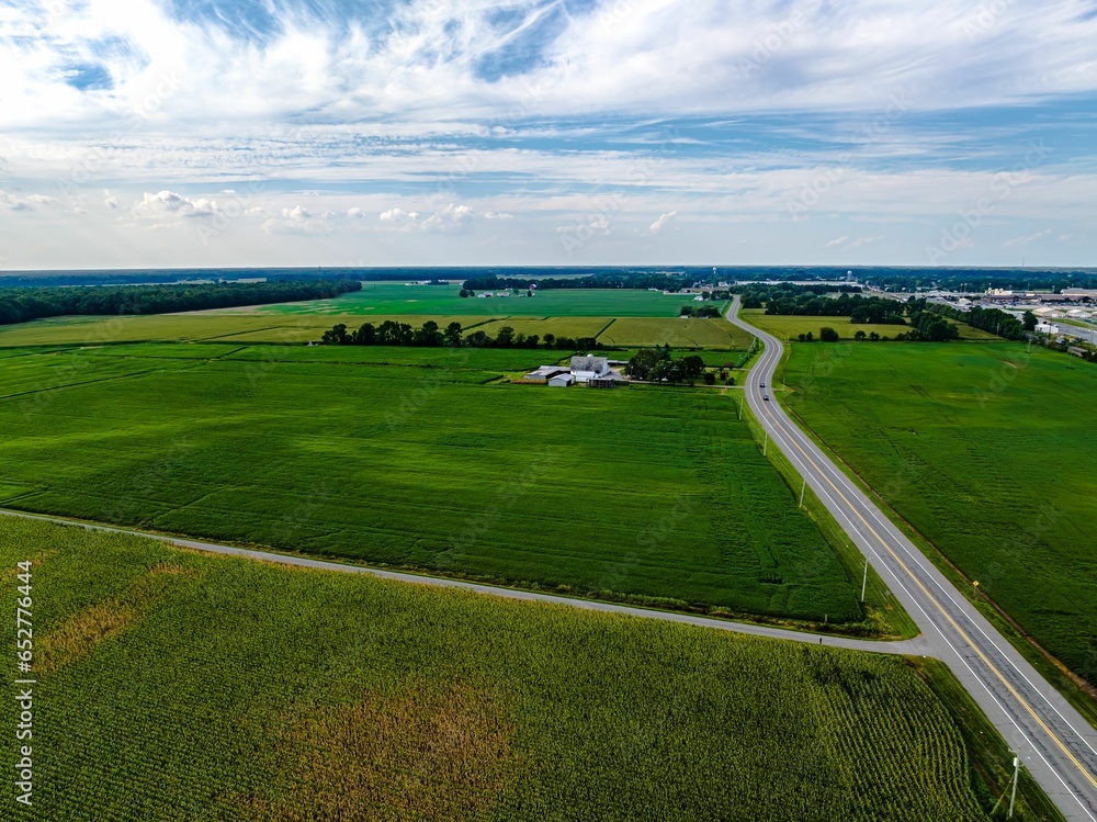 Sticker High angle aerial view of green farmland in the summer season in Delaware