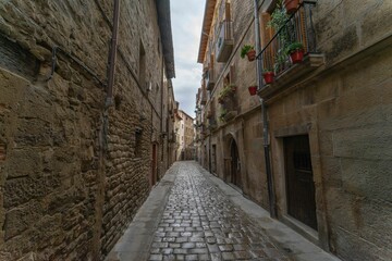 Narrow street between medieval houses in Tafalla, Navarra, Spain