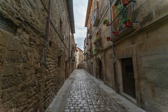 Narrow street between medieval houses in Tafalla, Navarra, Spain