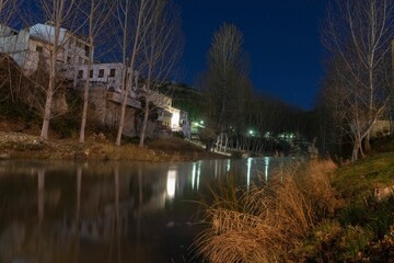 Photograph of the Tajo river as it passes through the town of Trillo. Tagus river at night.