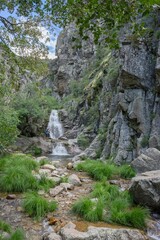 Waterfall in Rascafria on the route of purgatory in the mountains of Madrid
