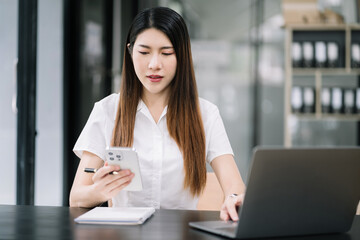 Modern woman typing and messaging with mobile phone. Women using cellphone app. Technology and computer workplace.