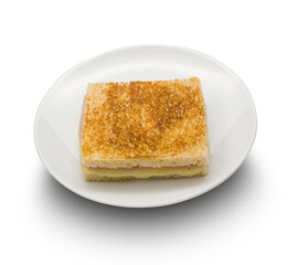 Sandwich de jamon y queso tostado en plato sobre fondo blanco. Toasted ham and cheese sandwich on plate on white background.