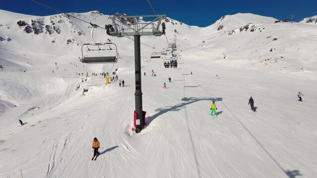The Remarkables, New Zealand: Point of view of footage of a chairlift up in the Remarkables ski resort near Queenstown in New Zealand in winter. 