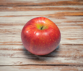 Red apple on an old table
