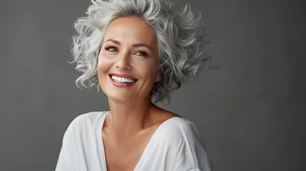 Foto op Canvas Elderly woman with gray hair is laughing and smiling, mature old lady with healthy face ans skin and white teeth © DigitalDreamscape