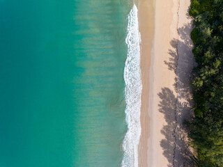 Sea surface aerial view,Bird eye view photo of crashing waves on sandy shore,Beach sea water...