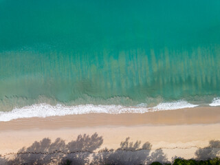 Sea surface aerial view,Bird eye view photo of crashing waves on sandy shore,Beach sea water...