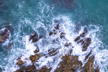 Aerial View Drone shot of waves crashing on seashore, Sea ocean background