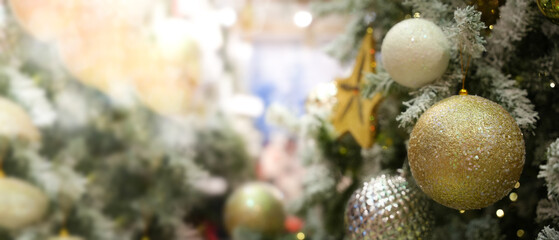 Obraz na płótnie Canvas Christmas Tree With Ornament And Bokeh Lights. Christmas Decoration. A christmas tree with decoration ornaments bauble and lights.