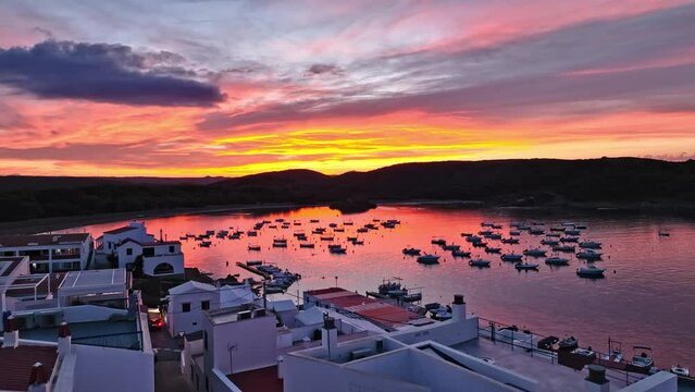 sunset over the tranquil city of Es Grau Menorca Spain