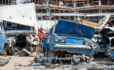 damaged and looted cars in a city in Ukraine during the war