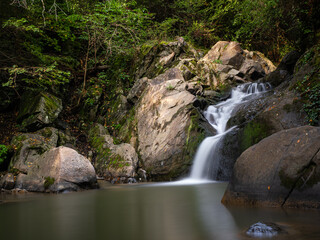 Beautiful waterfall in Covasna County framed by green moss and vegetation