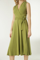 
Serie of studio photos of young female model in green viscose wrap dress. 