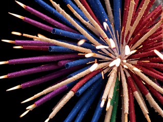 Fototapeta premium A Bunch Of Colored Pencils With A Black Background