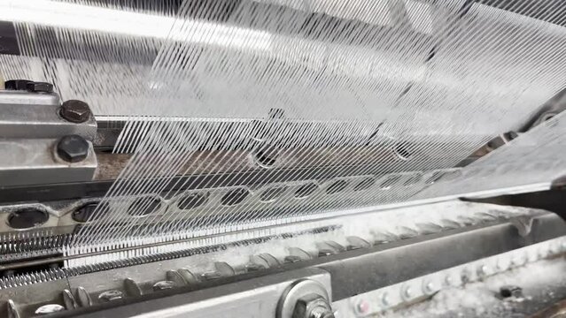 Industrial knitting machine for knitting textile fabrics