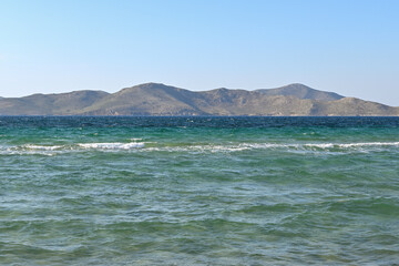Turquoise waters on the beach on the island of Kos. Pserimos island in the background.