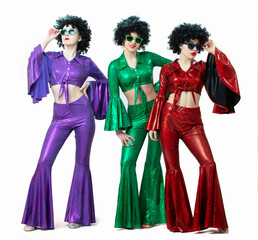 Disco style girls in colorful flared suits and African American wigs on a white background. Seventies or eighties style.