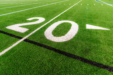 Obraz premium Synthetic turf football field twenty, 20, yard line in white. 