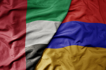big waving realistic national colorful flag of united arab emirates and national flag of armenia .