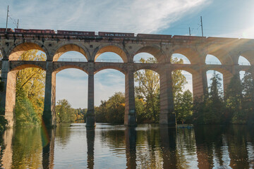 Railway Bridge with river in Bietigheim-Bissingen, Germany. Autumn. Railway viaduct over the Enz...