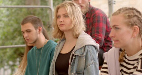 Portrait girl listens attentively to speaker at camp class. The process of remembering information girl focus. 