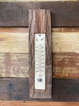 old wooden thermometer on wood