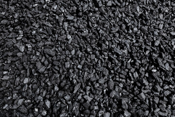 Black coal from the mine. Stone ore background. Energy industry. Solid fuel.