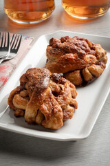 Fresh homemade cinnamon rolls on a dish close up