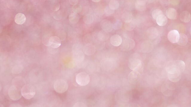 Festive glitter blurred shining love pink background with bokeh and highlights.	
