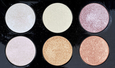 background of highlighter and glitter on purple background, Cosmetic products for makeup, skin...