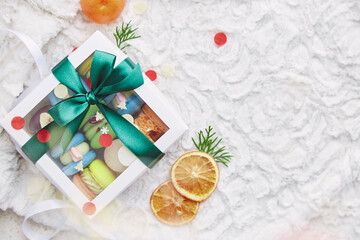 Fototapeta na wymiar Christmas box of macaroons, sweet present. New Year, Christmas gift background, copy space