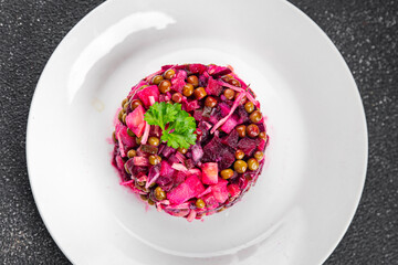 beet salad vegetable peas, carrots potatoes onions pickled cucumber meal food snack on the table copy space food background rustic top view