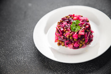 beet salad vegetable peas, carrots potatoes onions pickled cucumber meal food snack on the table copy space food background rustic top view