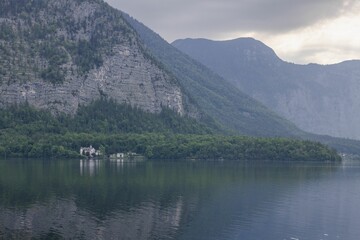 Idyllic landscape of Hallstatt Lake and Schloss Grub Castle in Austria