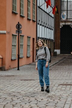 Beautiful young female traveller exploring Old Town Gdansk, Poland