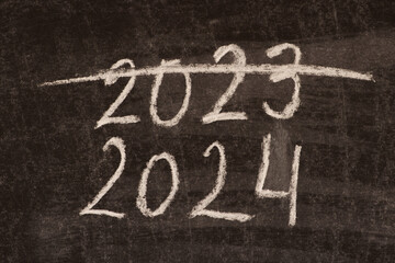 The concept of the end of 2023 and the beginning of the 2024 new year. - obrazy, fototapety, plakaty