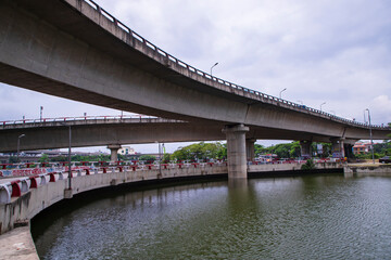 Non-stop speedway  Kuril Flyover with cloudy sky and lake in Dhaka Bangladesh