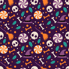 Halloween pattern background with halloween skull and candy on dark background