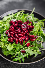 salad red bean arugula meal green lettuce leaf appetizer food snack on the table copy space food background rustic top view 