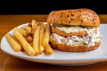 salmon burger with cole slaw on a everything  brioche bun