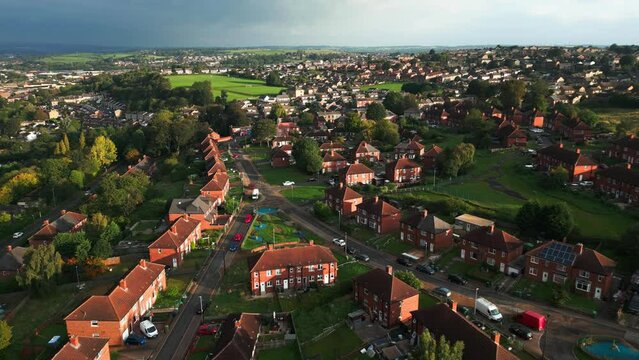 A drone's-eye view captures Dewsbury Moore Council estate's fame, a typical UK urban council-owned housing development with red-brick terraced homes and the industrial Yorkshire